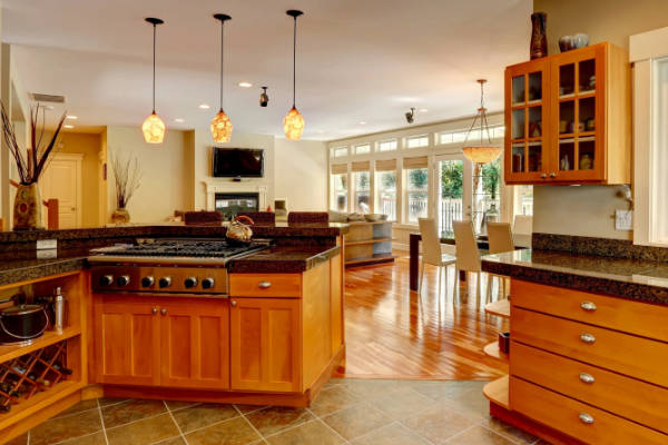 kitchen-upgrade-granite-countertops-img traditional kitchen with tile flooring, brown wood cabinets